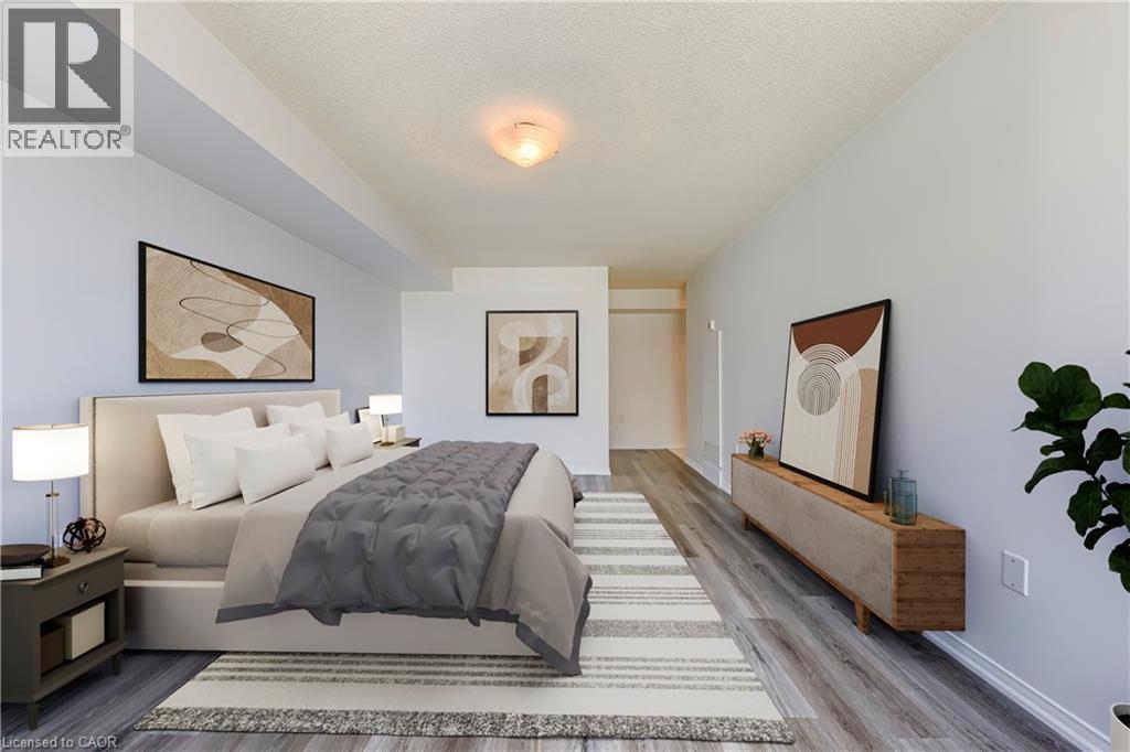 Spacious room featuring light gray walls, wood-finish flooring, and a textured ceiling - 1270 Maple Crossing Boulevard Unit# 1705, Burlington, ON - Indoor Photo Showing Bedroom