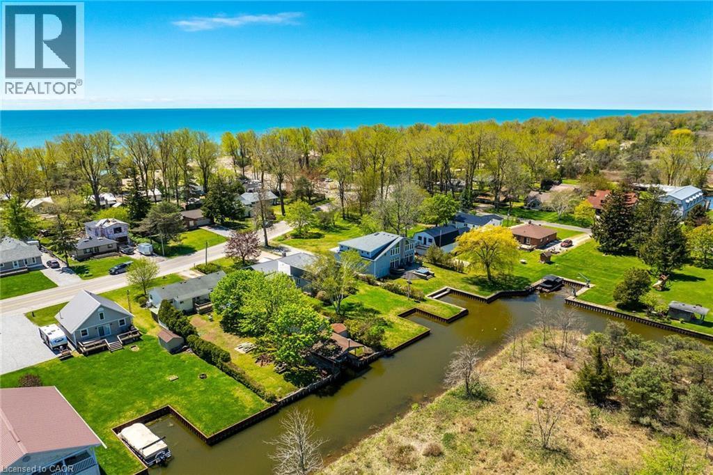 Aerial perspective showcasing waterfront properties with private boat slips - 270 Erie Boulevard, Long Point, ON - Outdoor With Body Of Water With View