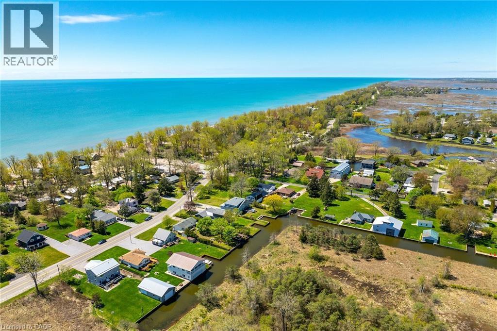 Aerial perspective showcasing coastal properties situated on a body of water - 270 Erie Boulevard, Long Point, ON - Outdoor With Body Of Water With View