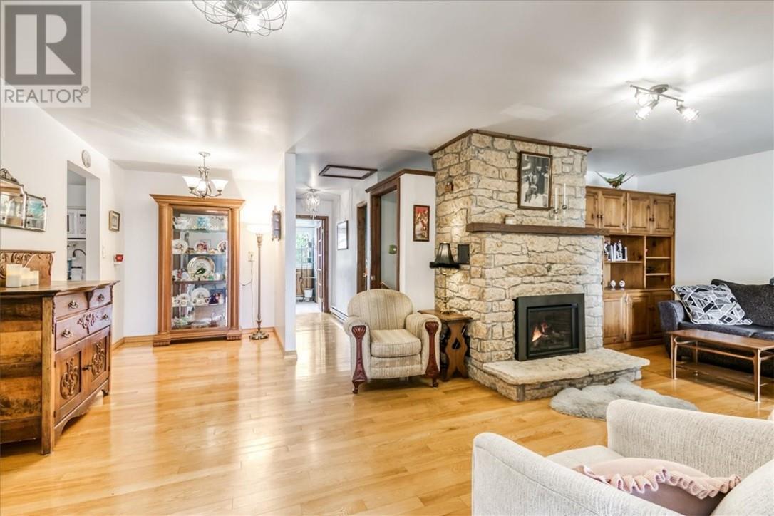 82A Pennie Avenue, Tehkummah, ON - Indoor Photo Showing Living Room With Fireplace