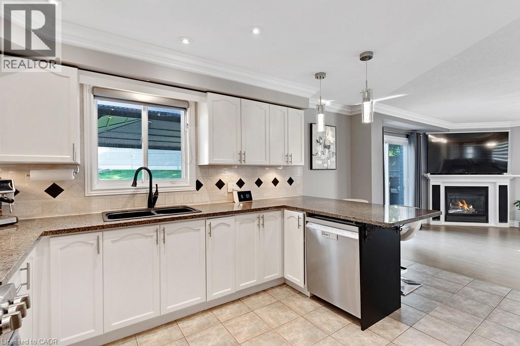 84 Amanda Walk, Cambridge, ON - Indoor Photo Showing Kitchen With Fireplace With Double Sink