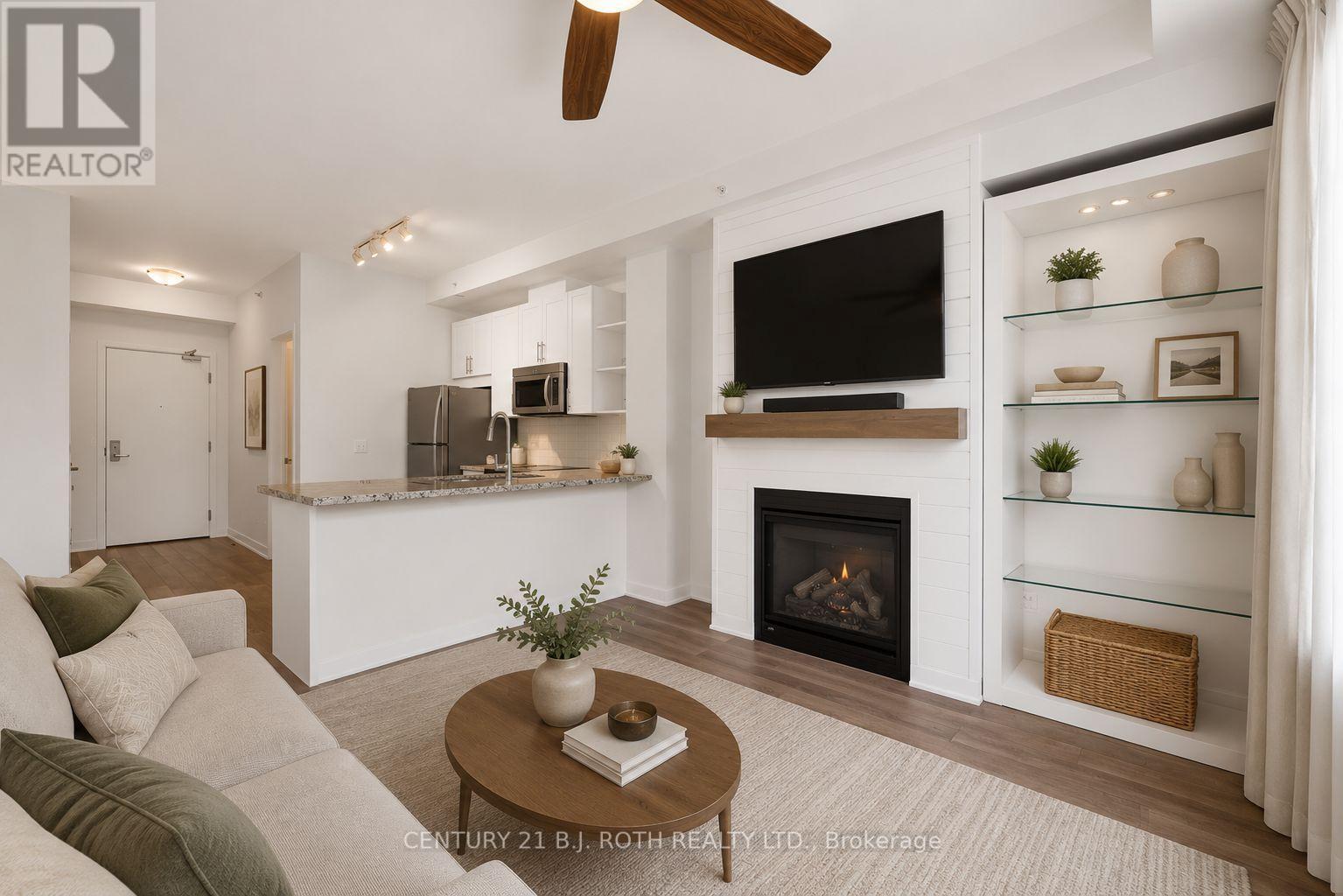 310 - 40 Horseshoe Boulevard, Oro-Medonte, ON - Indoor Photo Showing Living Room With Fireplace