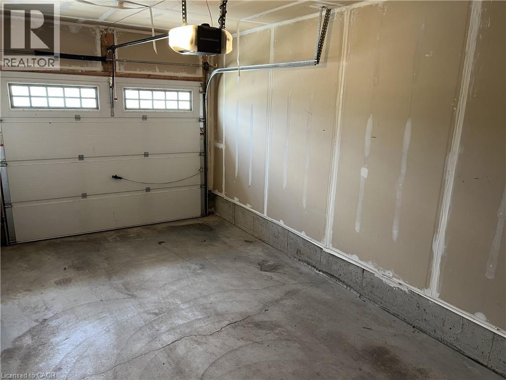 With garage door opener - 56 Eliza Avenue, Kitchener, ON - Indoor Photo Showing Garage