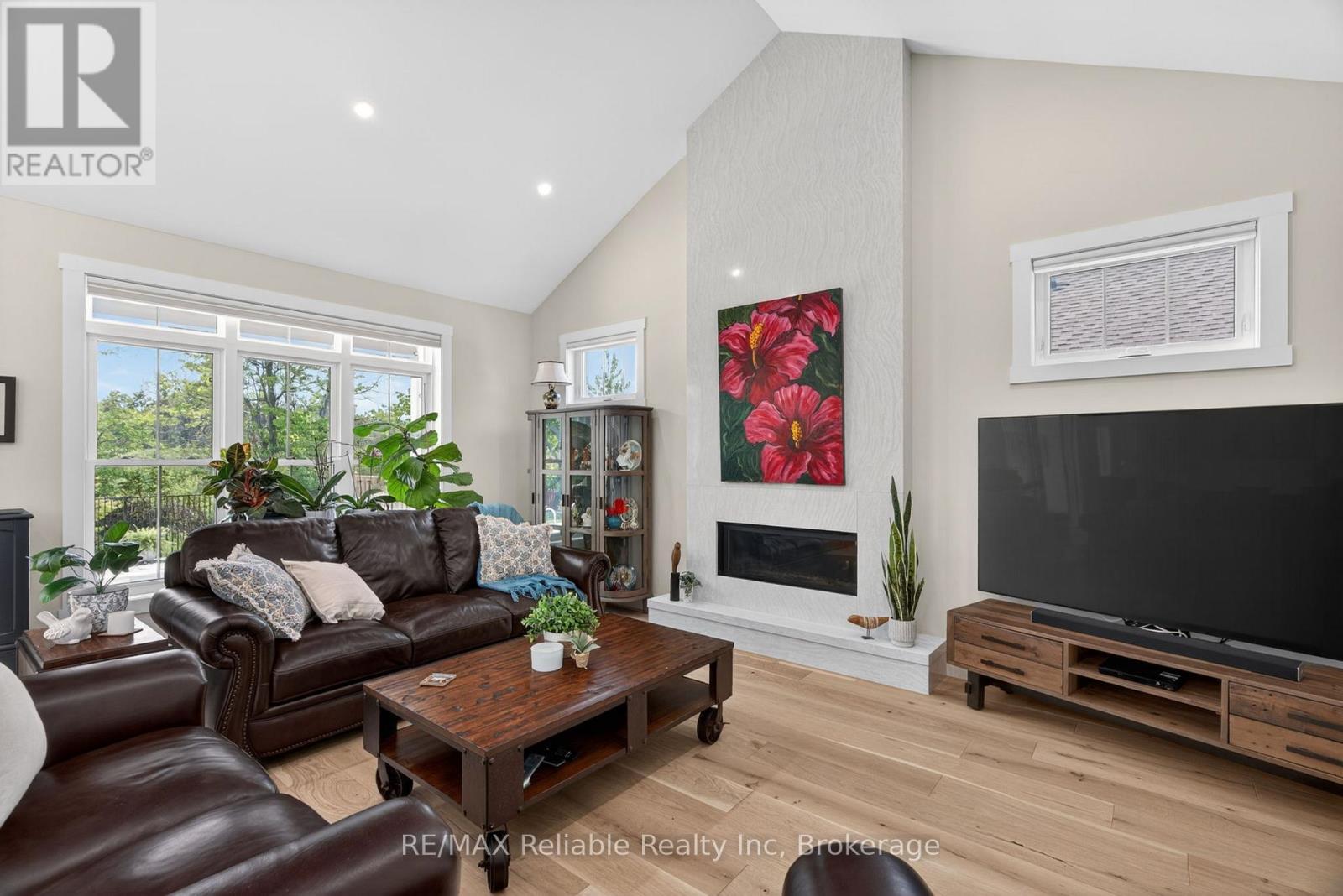 Power blinds controlled by phone app. - 14 Thimbleweed Drive, Bluewater (Bayfield), ON - Indoor Photo Showing Living Room With Fireplace