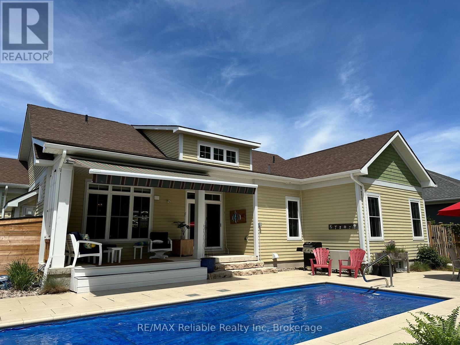 Power awning - 14 Thimbleweed Drive, Bluewater (Bayfield), ON - Outdoor With In Ground Pool With Deck Patio Veranda