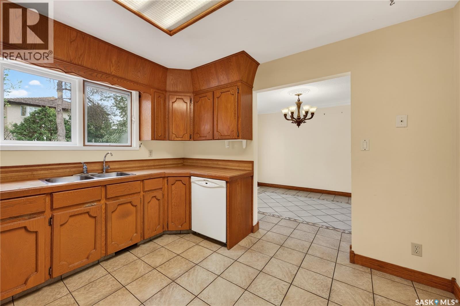 83 Groome Avenue, Regina, SK - Indoor Photo Showing Kitchen With Double Sink