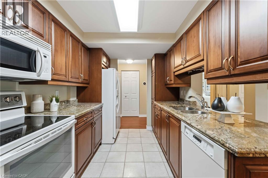 970 Golf Links Road Unit# 205, Ancaster, ON - Indoor Photo Showing Kitchen With Double Sink