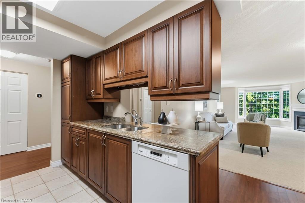 970 Golf Links Road Unit# 205, Ancaster, ON - Indoor Photo Showing Kitchen With Double Sink