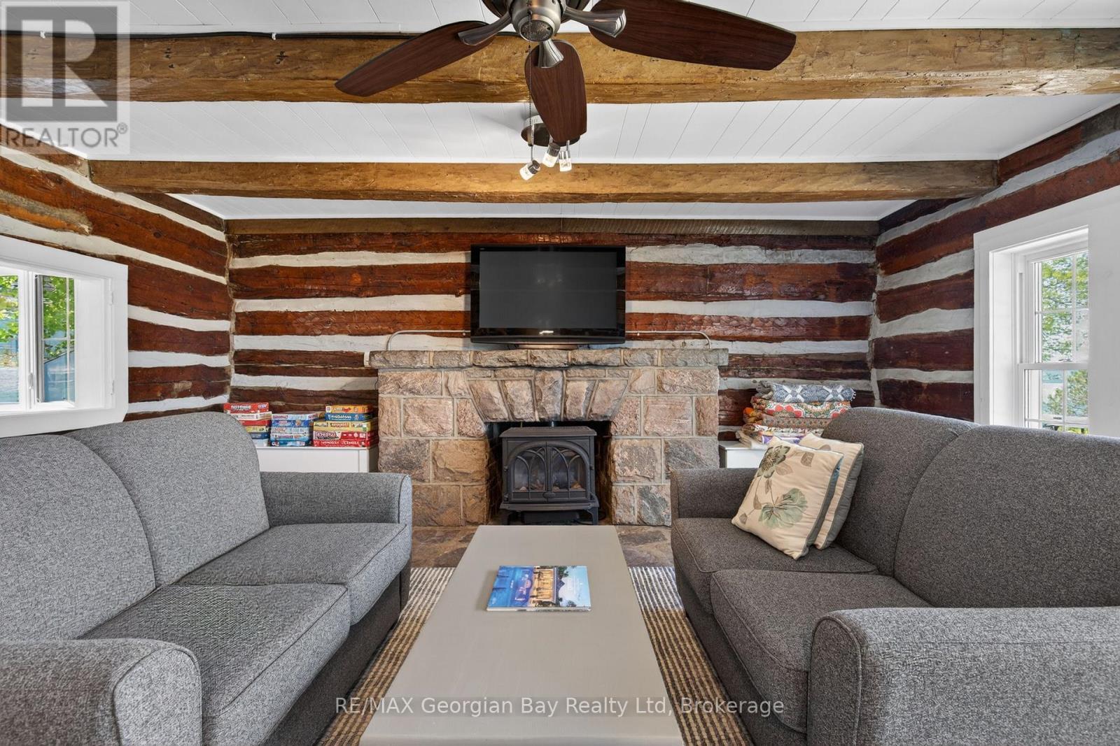 83 Beach Road, Tiny, ON - Indoor Photo Showing Living Room With Fireplace
