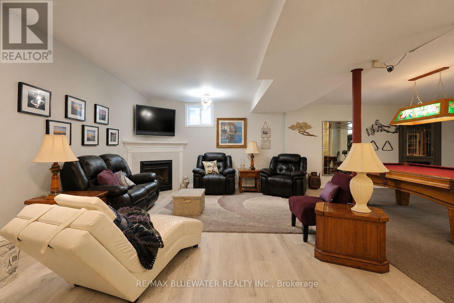 10419 Pinetree Drive, Lambton Shores (Grand Bend), ON - Indoor Photo Showing Living Room With Fireplace