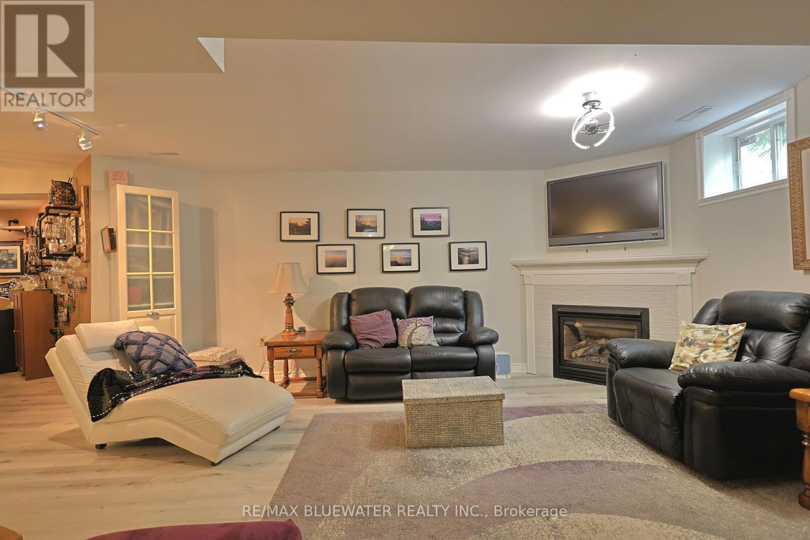 10419 Pinetree Drive, Lambton Shores (Grand Bend), ON - Indoor Photo Showing Living Room With Fireplace