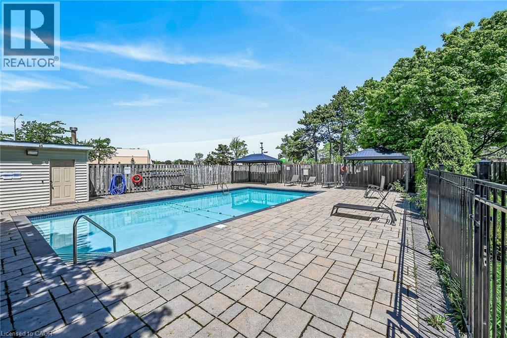 700 Dynes Road Unit# 101, Burlington, ON - Outdoor With In Ground Pool