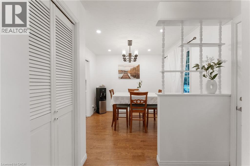 Dining space featuring light wood-style floors, recessed lighting, and a chandelier - 32 Donly Drive N, Simcoe, ON - Indoor