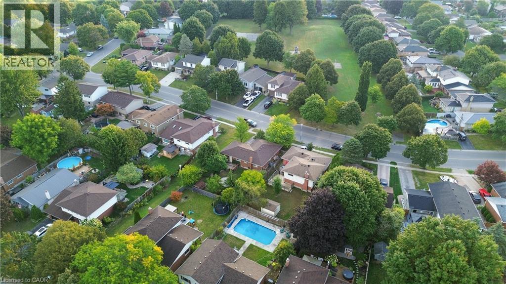 Aerial perspective of suburban area with a pool area - 32 Donly Drive N, Simcoe, ON - Outdoor With View