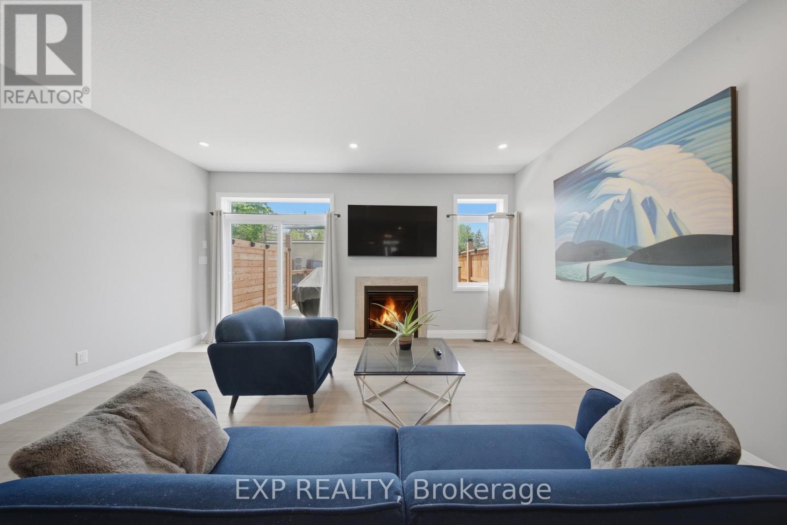 107 Stephenson Way, Minto, ON - Indoor Photo Showing Living Room With Fireplace