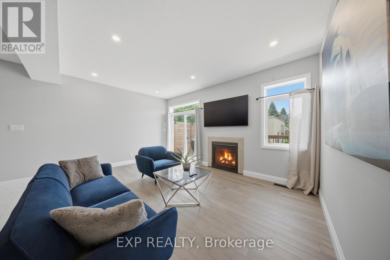 107 Stephenson Way, Minto, ON - Indoor Photo Showing Living Room With Fireplace