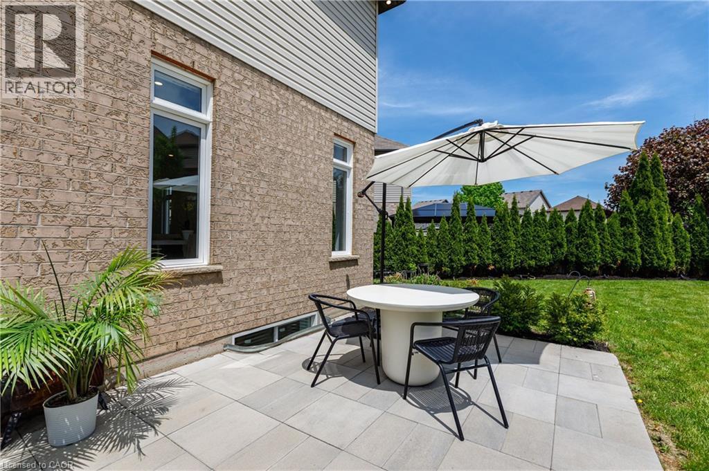 Patio area featuring light-toned paver stones - 916 Steepleridge Court, Kitchener, ON - Outdoor