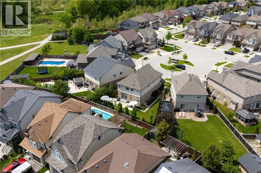 Aerial view of a residential neighborhood with diverse roofing styles, including asphalt shingles and light-colored siding - 916 Steepleridge Court, Kitchener, ON - Outdoor With View