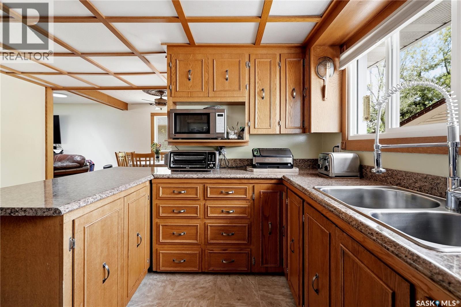 104 Marsh Crescent, Regina, SK - Indoor Photo Showing Kitchen With Double Sink