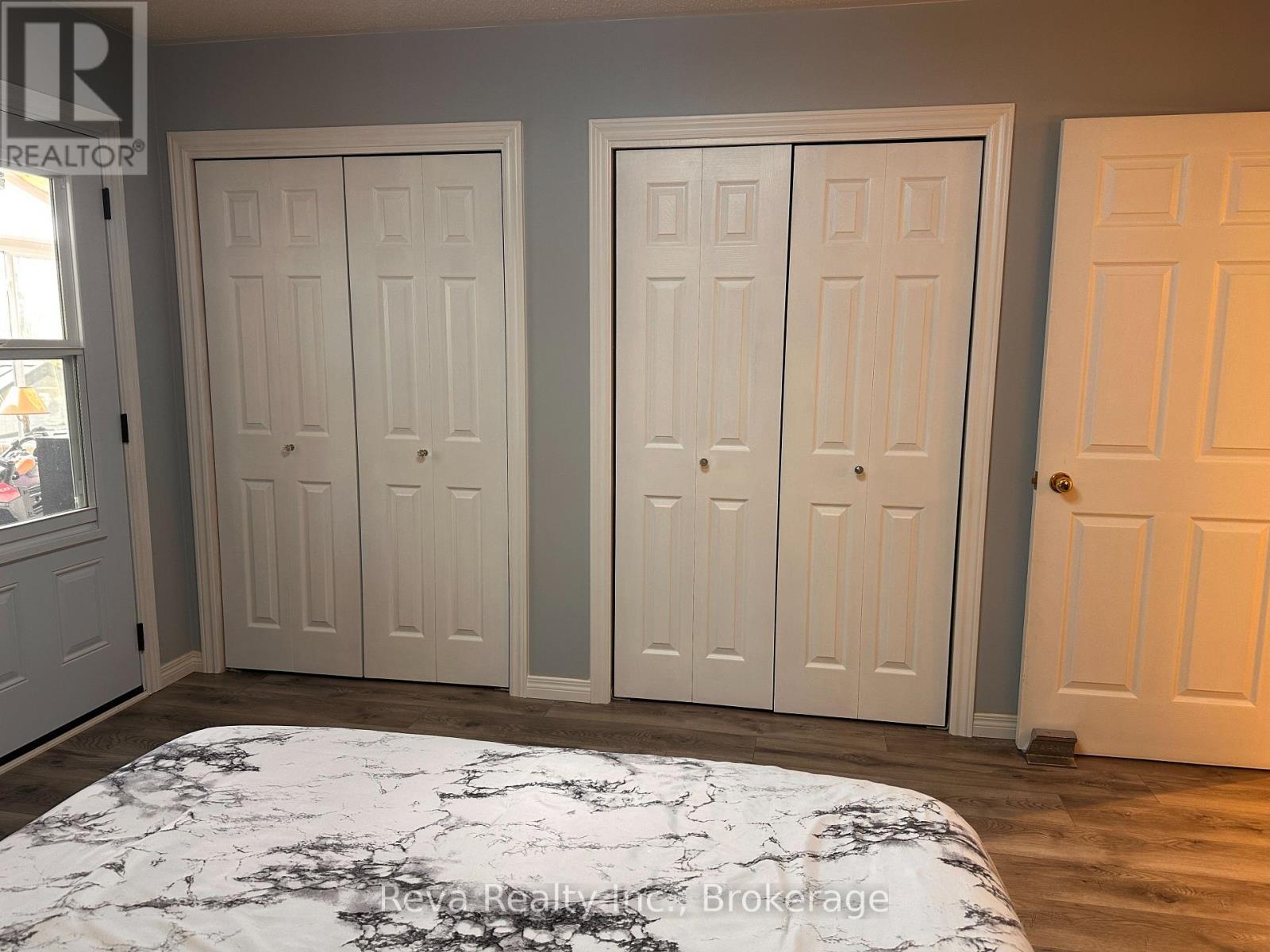 Primary Bedroom with Double Closets - 11 Ridge Road, Bancroft (Bancroft Ward), ON - Indoor Photo Showing Bedroom