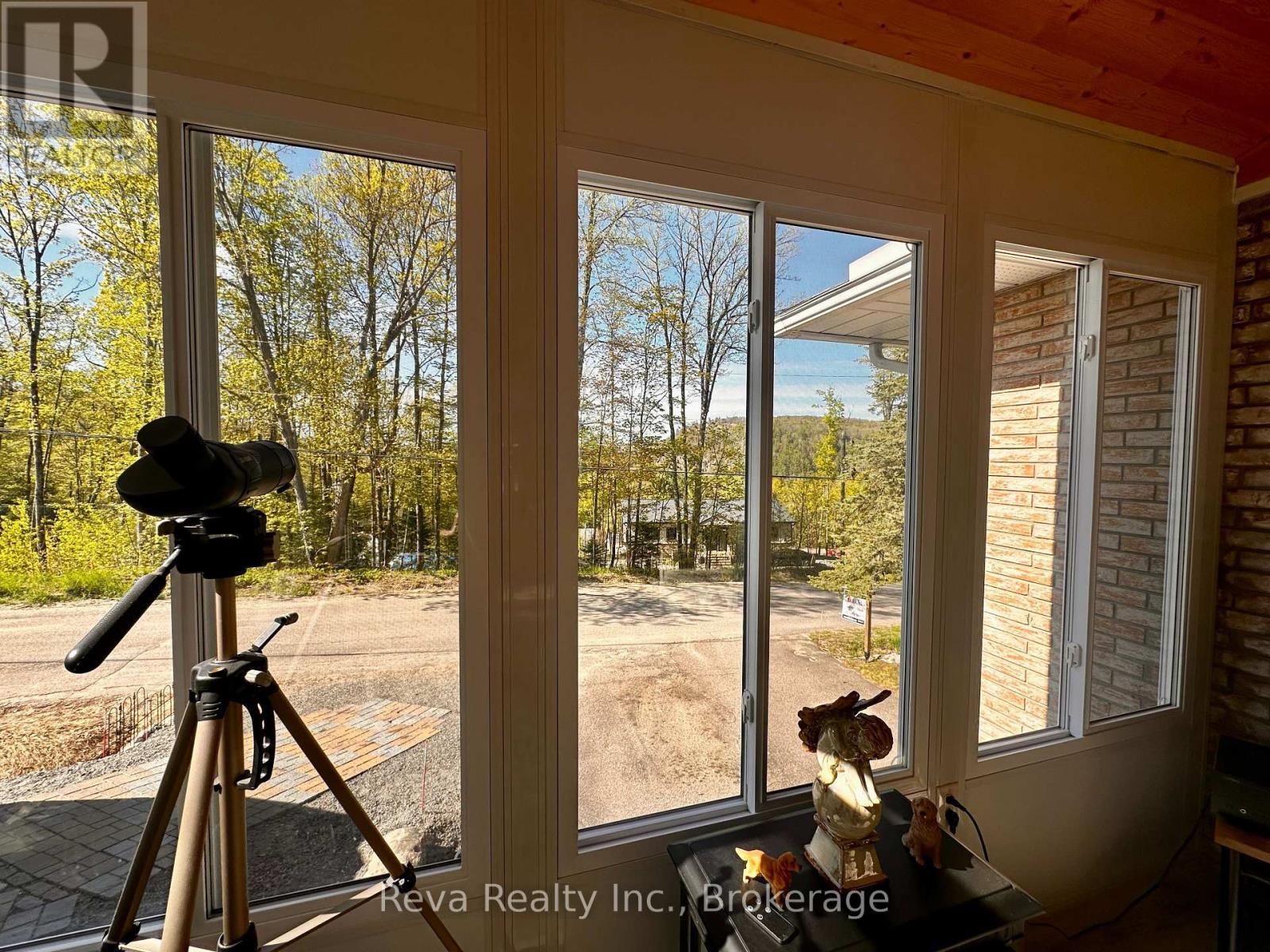 View from the Sunroom - 11 Ridge Road, Bancroft (Bancroft Ward), ON - With Deck Patio Veranda With Exterior