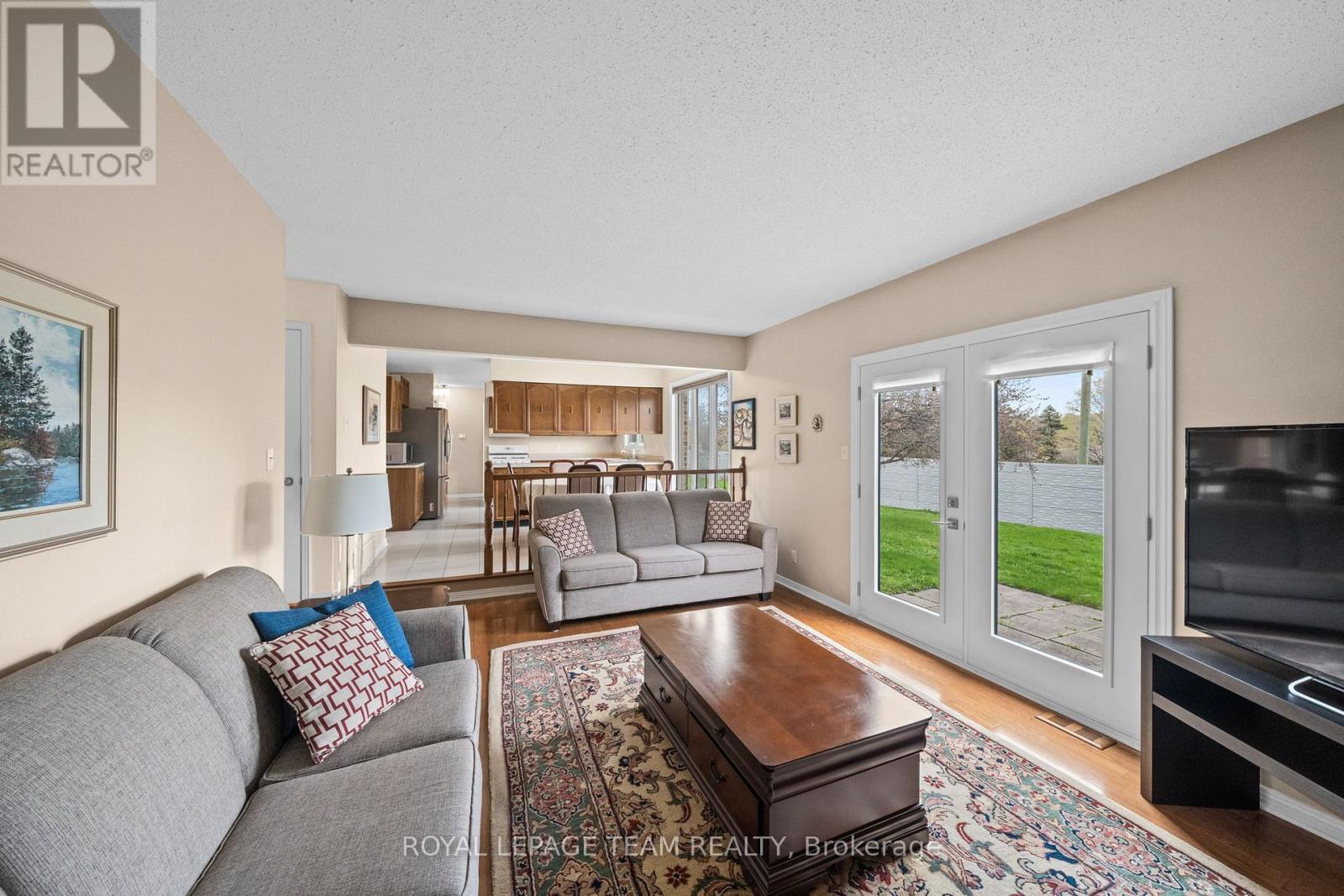 Sunken Den/Living Room with w/o to backyard - 28 Parmalea Crescent, Ottawa, ON - Indoor Photo Showing Living Room