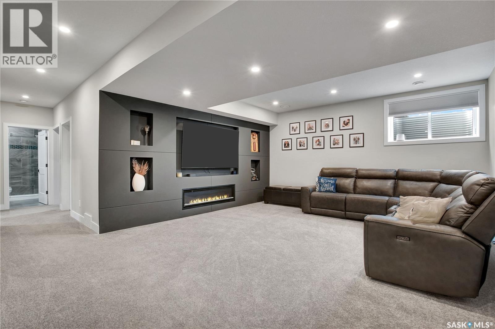 2 437 Palmer Crescent, Warman, SK - Indoor With Fireplace