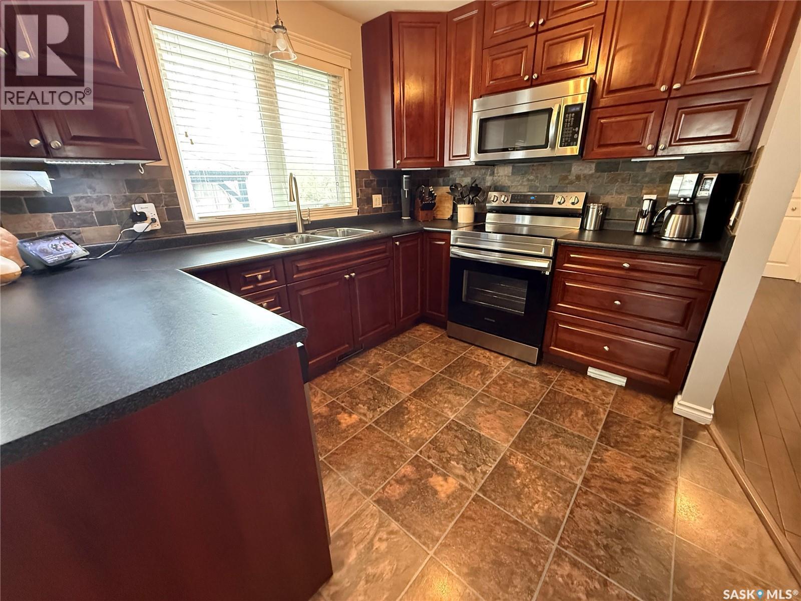 1920 Dyer Road, Estevan, SK - Indoor Photo Showing Kitchen With Double Sink