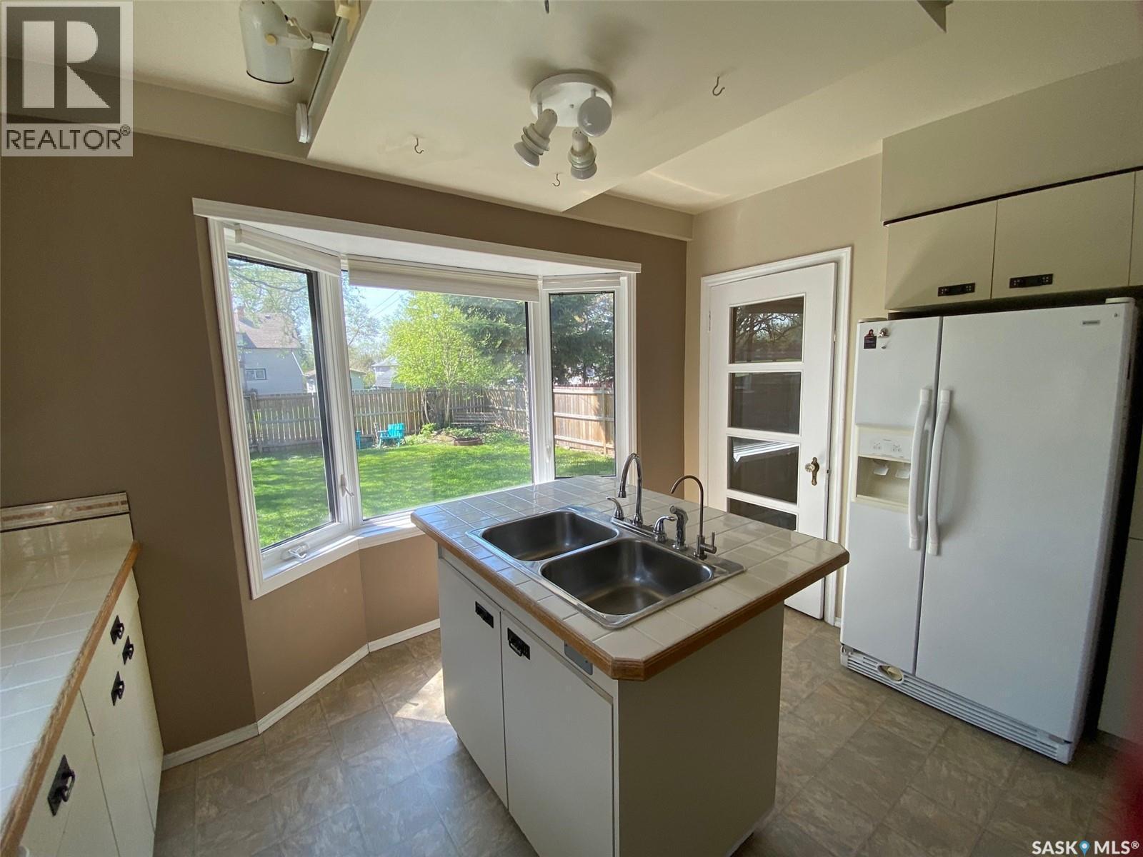 210 First Avenue, Yorkton, SK - Indoor Photo Showing Kitchen With Double Sink