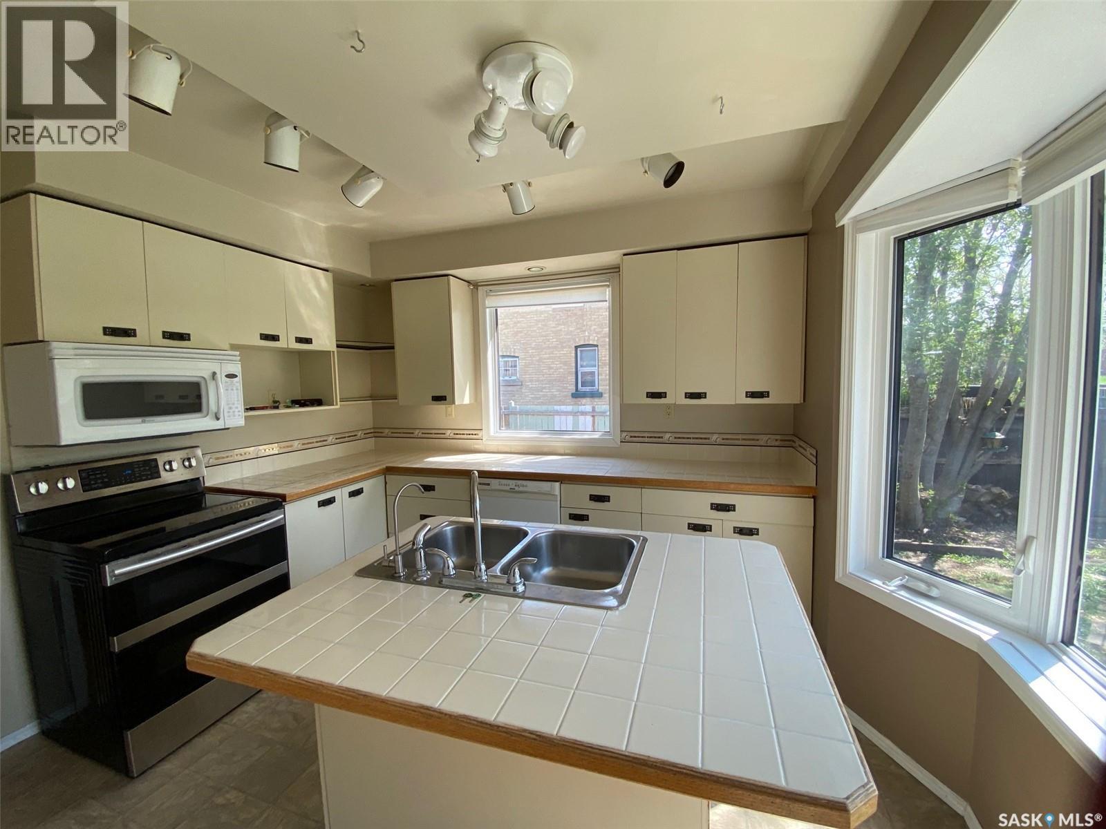 210 First Avenue, Yorkton, SK - Indoor Photo Showing Kitchen With Double Sink