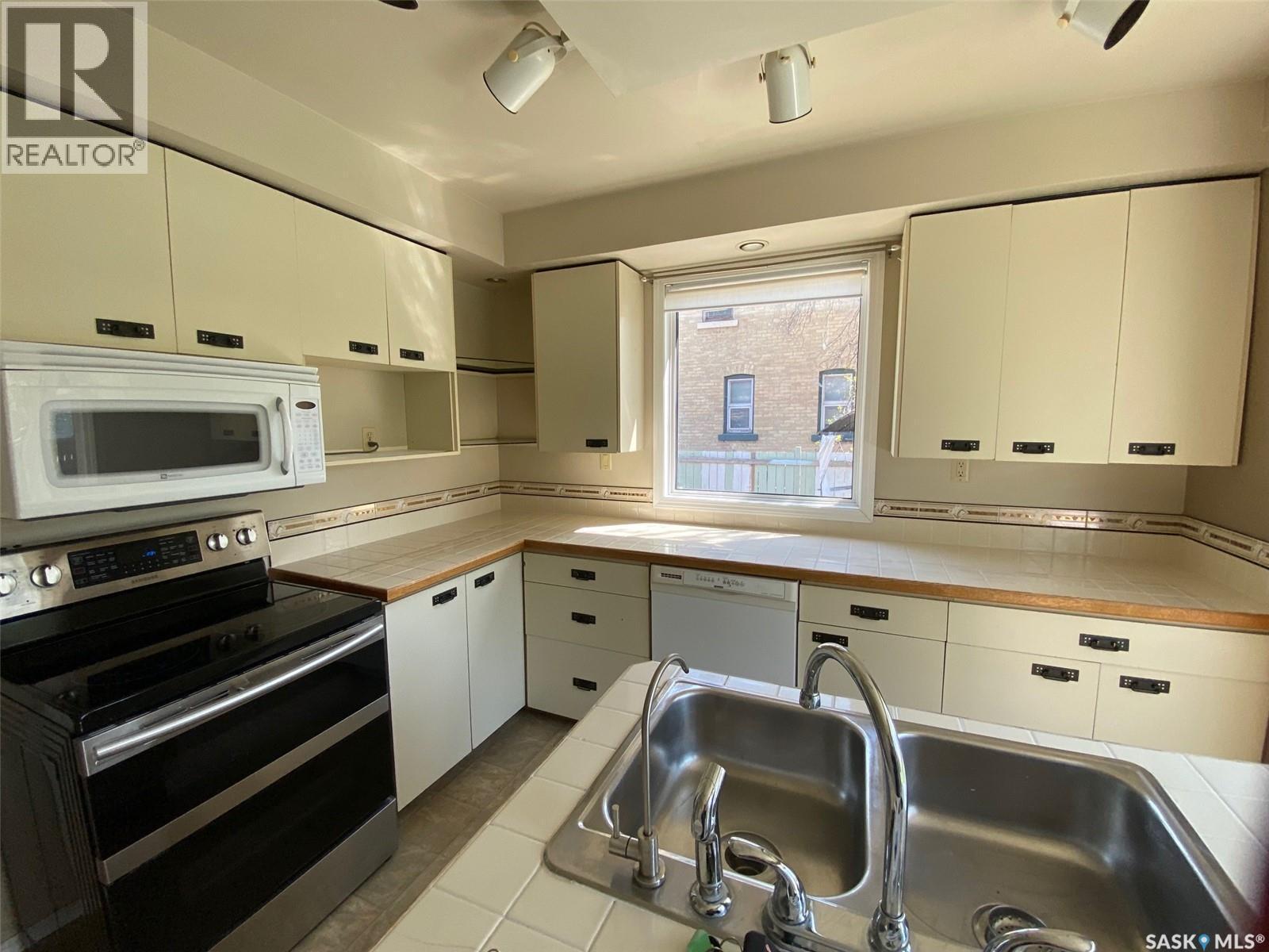 210 First Avenue, Yorkton, SK - Indoor Photo Showing Kitchen With Double Sink