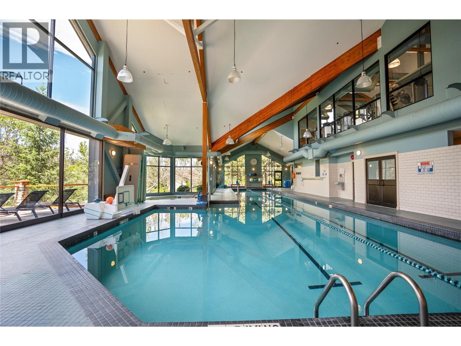 105 Predator Ridge Drive Unit# 21, Vernon, BC - Indoor Photo Showing Other Room With In Ground Pool