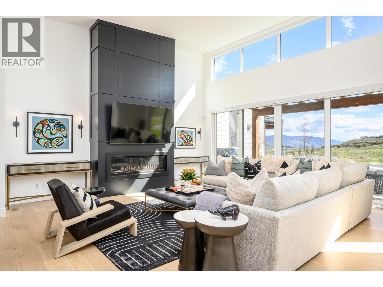 105 Predator Ridge Drive Unit# 21, Vernon, BC - Indoor Photo Showing Living Room With Fireplace