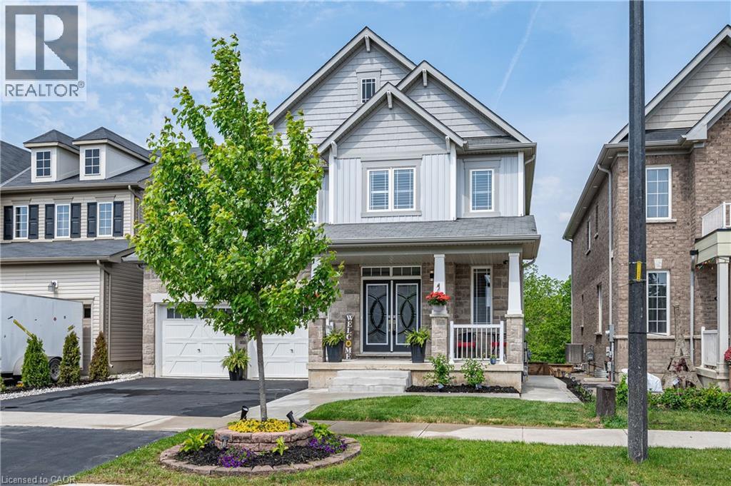 Contemporary two-story residence featuring a stone and siding facade - 9 Fleming Crescent, Caledonia, ON - Outdoor With Facade