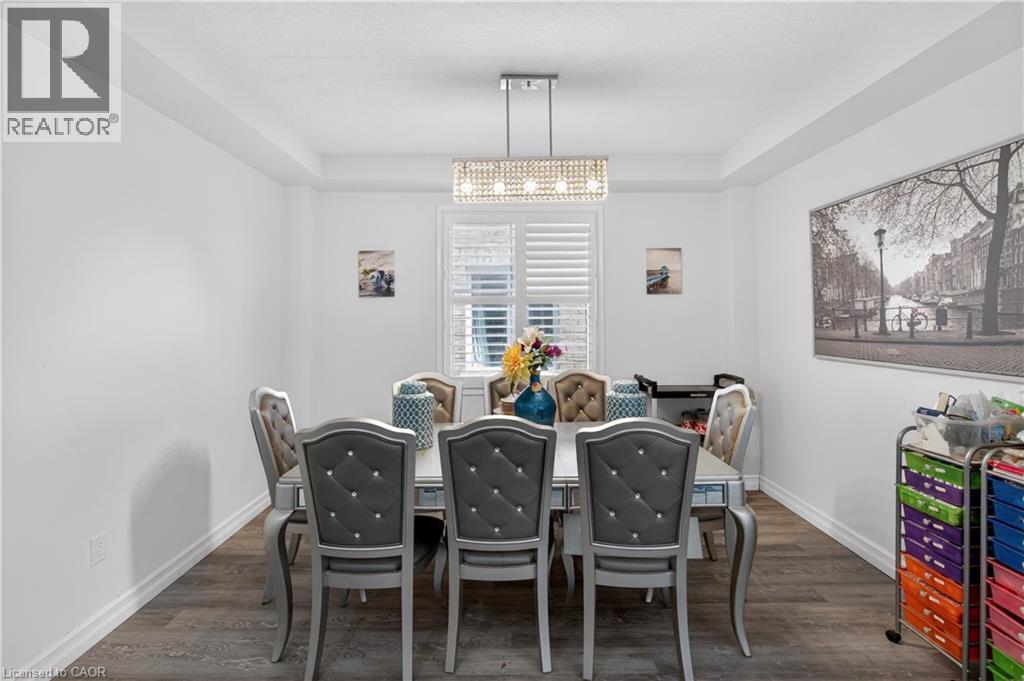 Dining area featuring wood-finish flooring, white walls, and a recessed ceiling - 9 Fleming Crescent, Caledonia, ON - Indoor Photo Showing Dining Room