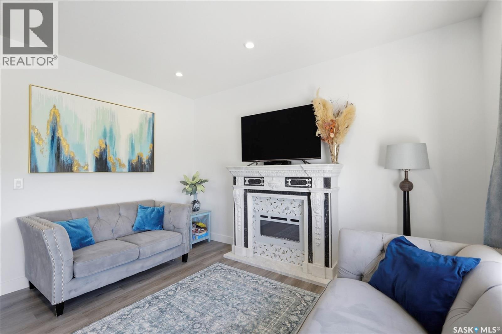 335 Hassard Close, Saskatoon, SK - Indoor Photo Showing Living Room With Fireplace
