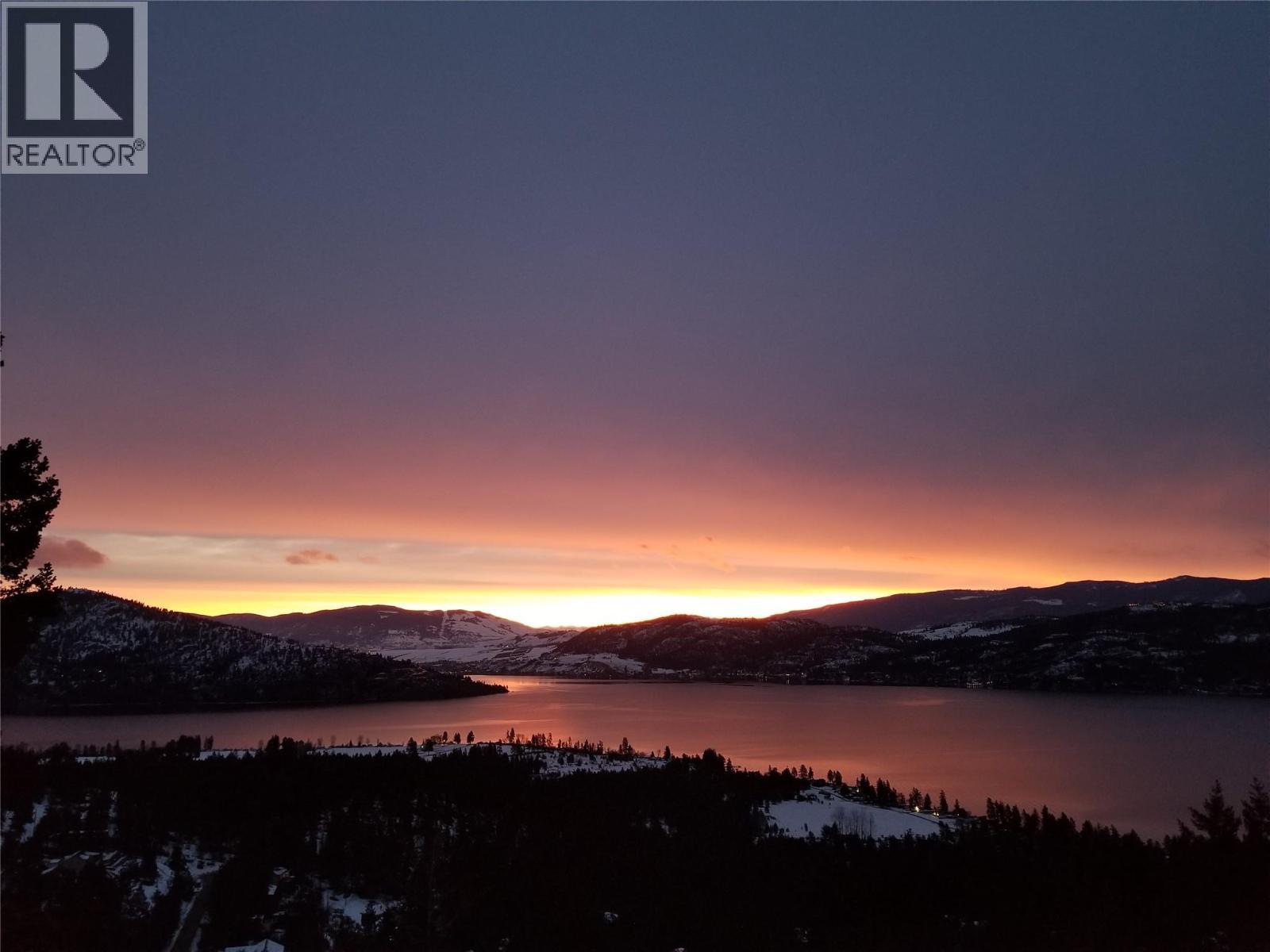 Sunrise view from 132 Crown Crescent. - 132 Crown Crescent, Vernon, BC - Outdoor With Body Of Water With View