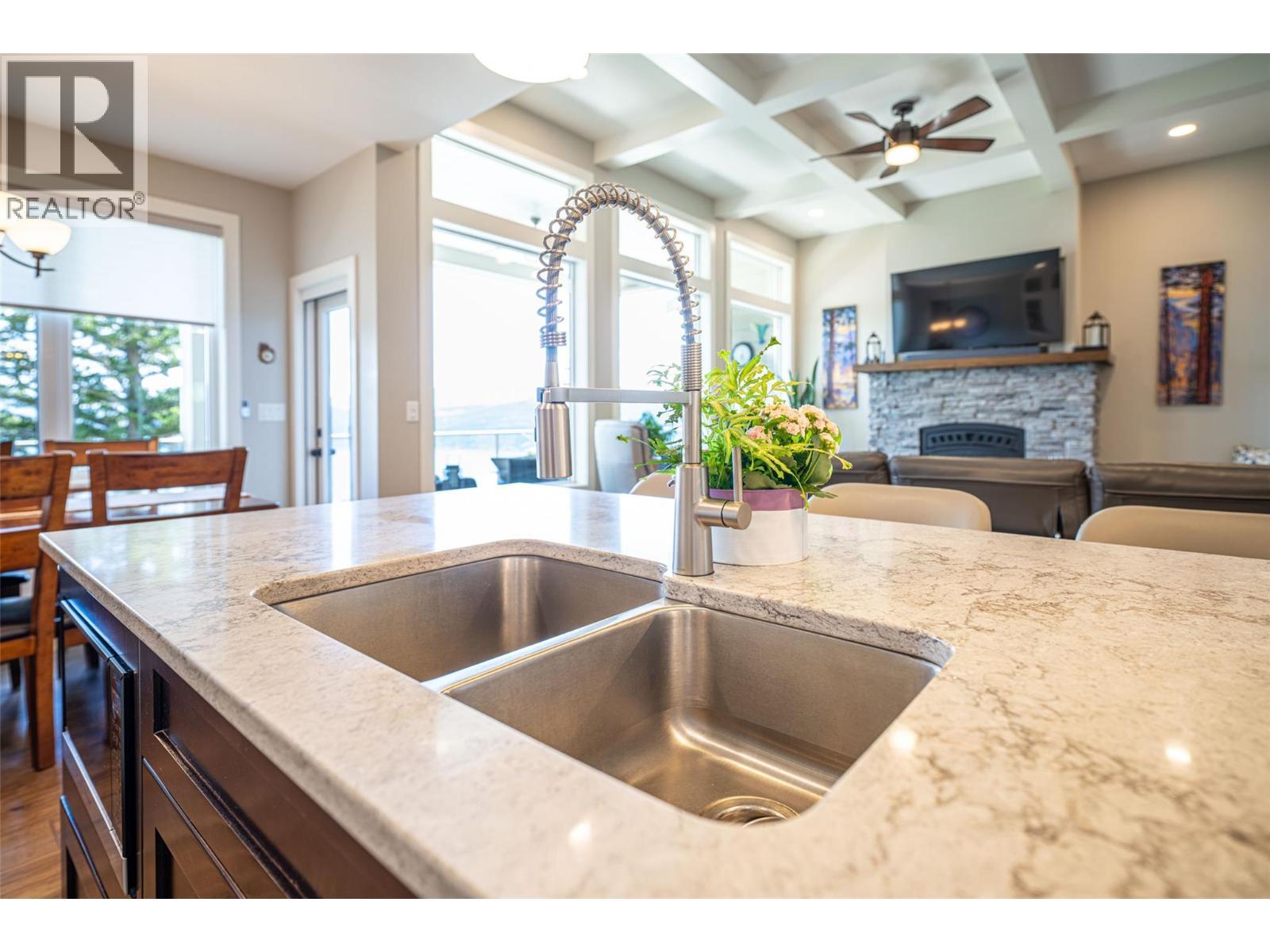 Kitchen - 132 Crown Crescent, Vernon, BC - Indoor Photo Showing Kitchen With Fireplace With Double Sink