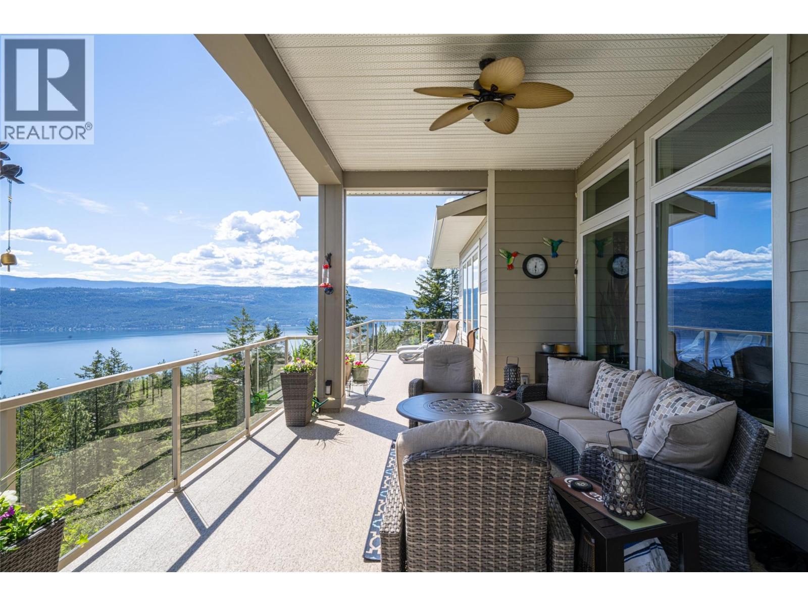 Balcony with 180° views of Okanagan Lake - 132 Crown Crescent, Vernon, BC - Outdoor With Body Of Water With View With Exterior