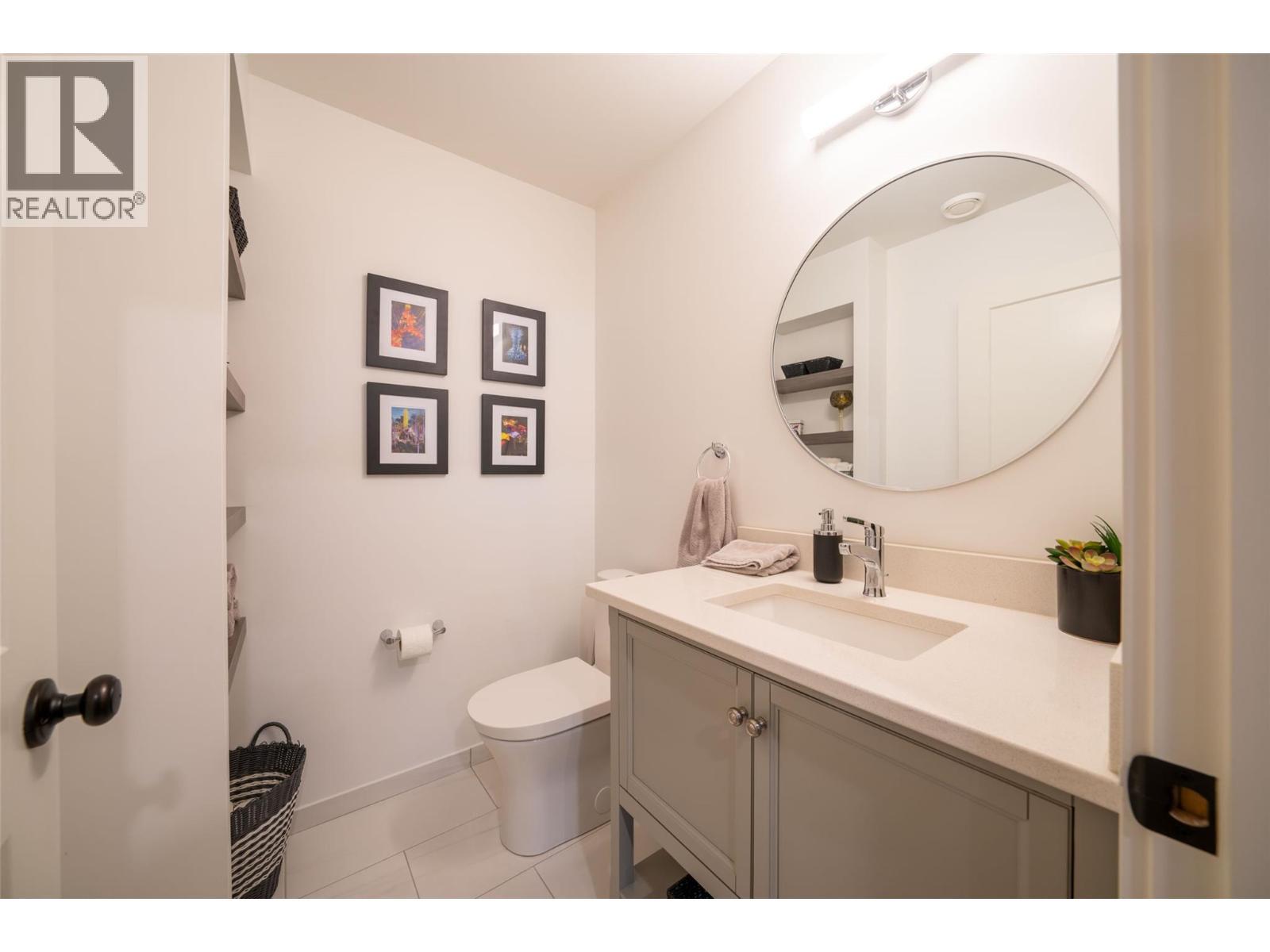 Basement bathroom next to family room - 132 Crown Crescent, Vernon, BC - Indoor Photo Showing Bathroom