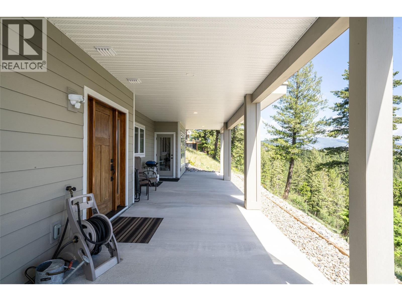 walkout in-law suite patio and entrance - 132 Crown Crescent, Vernon, BC - Outdoor With Exterior