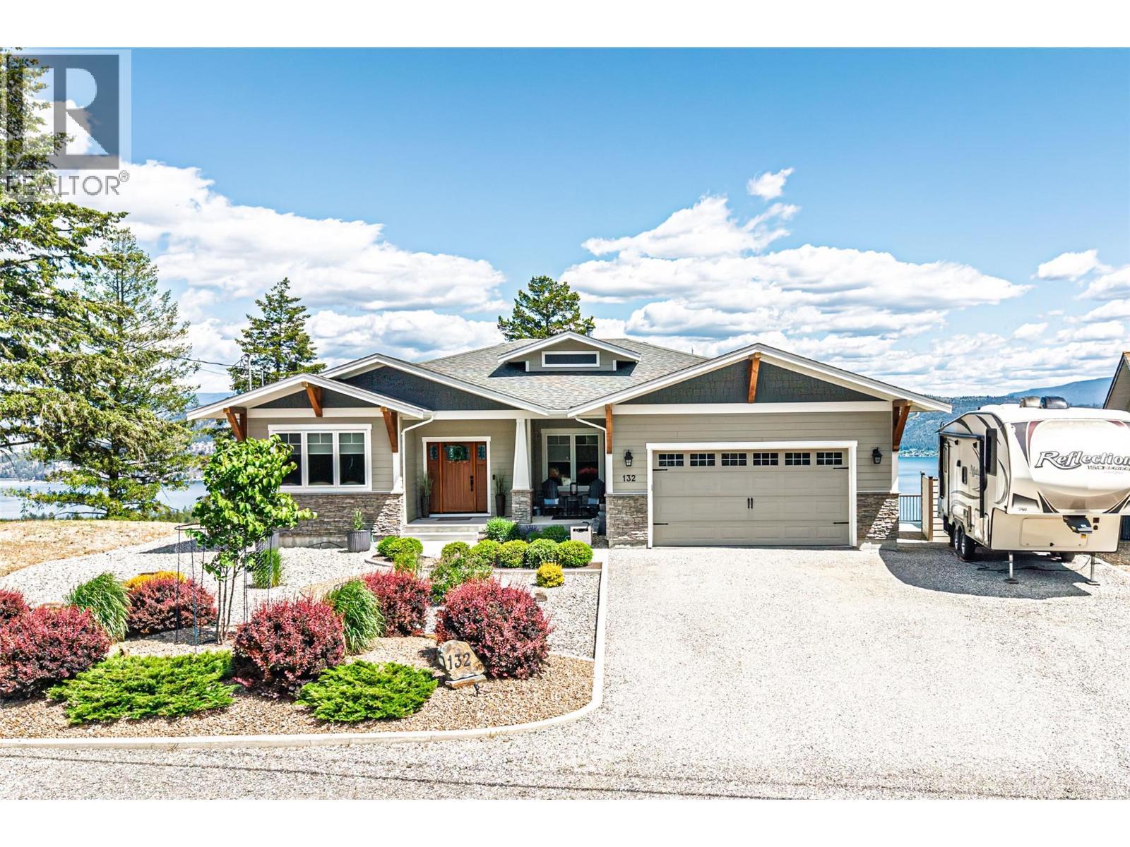 Lots of parking and oversized double garage + 30 AMP RV plug outside - 132 Crown Crescent, Vernon, BC - Outdoor With Facade