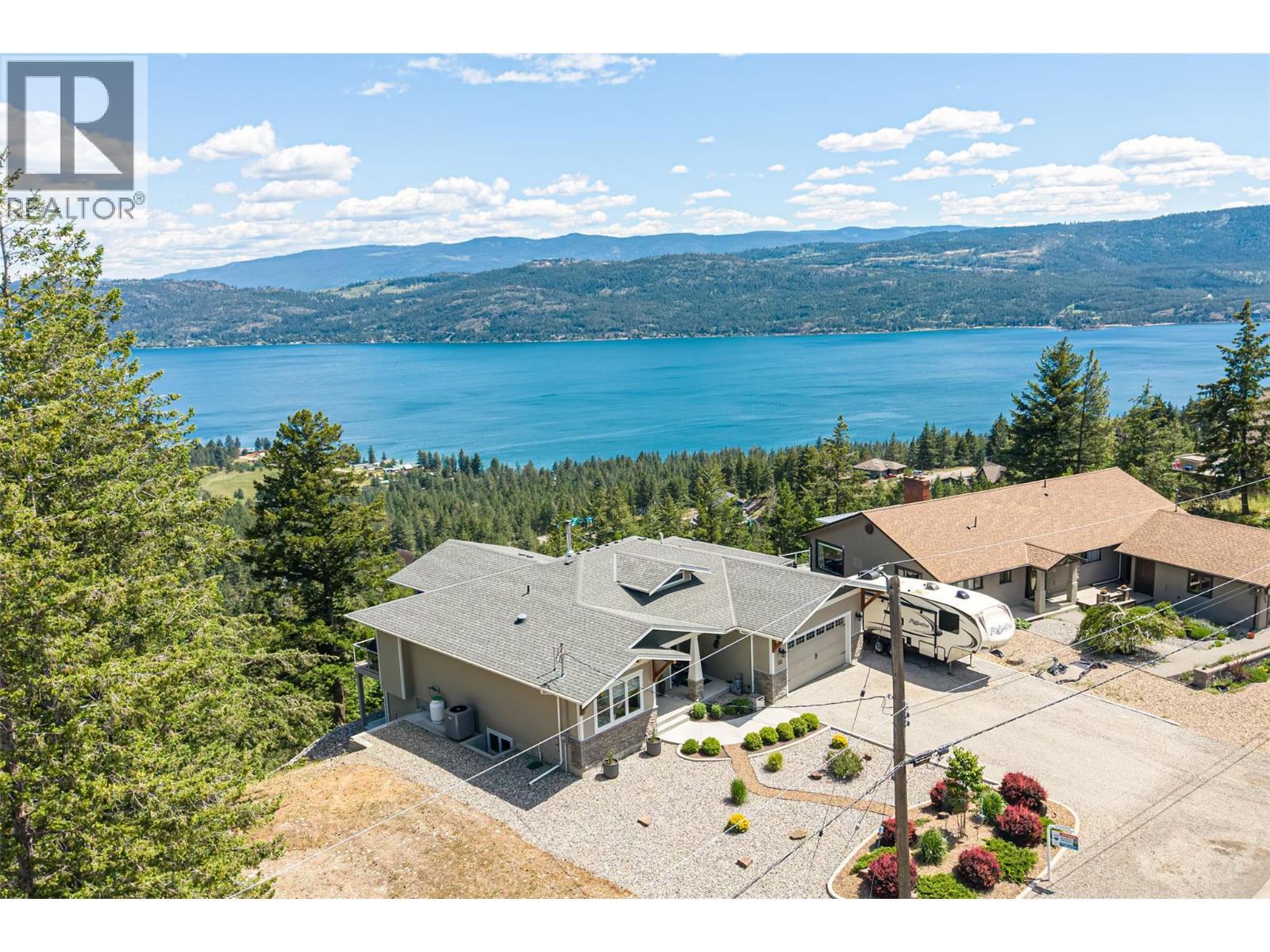 custom built home overlooking Okanagan Lake - 132 Crown Crescent, Vernon, BC - Outdoor With Body Of Water With View