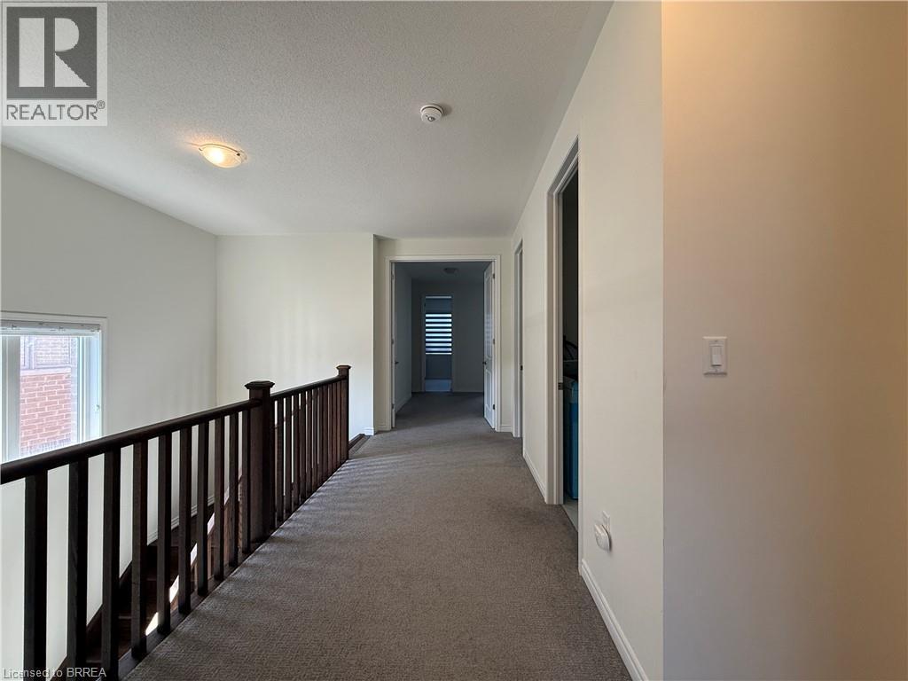 Upper-level hallway featuring neutral wall tones and plush carpeting - 18 Dolucci Crescent, Brampton, ON - Indoor Photo Showing Other Room