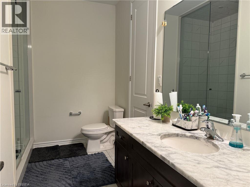Bathroom vanity with a white-grey veined countertop and an undermount sink - 18 Dolucci Crescent, Brampton, ON - Indoor Photo Showing Bathroom