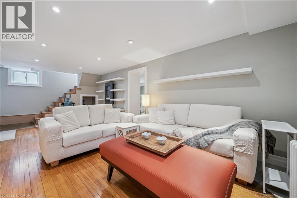 family room with hardwood flooring - 128 Wilhelm Street, Kitchener, ON - Indoor Photo Showing Living Room