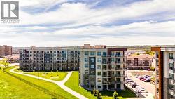 Modern multi-story residential buildings featuring varied facade materials including stone veneer, paneling, and extensive window treatments -