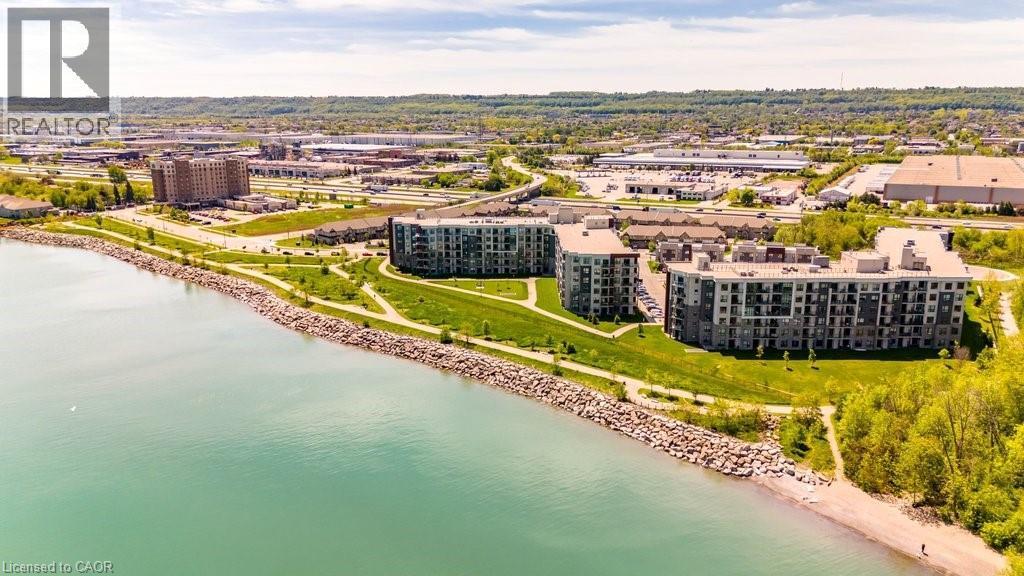 Waterfront condominium buildings featuring modern architecture, private balconies, and surrounding green spaces - 101 Shoreview Place Unit# 631, Stoney Creek, ON - Outdoor With Body Of Water With View