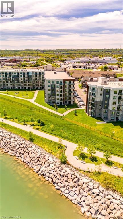 Contemporary multi-story buildings featuring balconies and large windows - 101 Shoreview Place Unit# 631, Stoney Creek, ON - Outdoor With Body Of Water With View