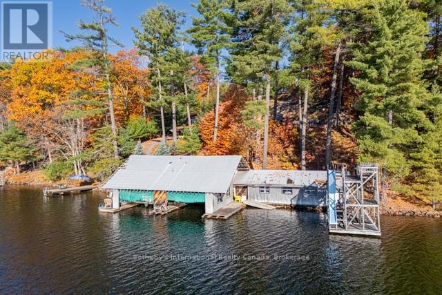 2500 sq ft loft Boathouse ready for redevelopment - 5 - 1028 Oak Street, Muskoka Lakes (Medora), ON - Outdoor With Body Of Water